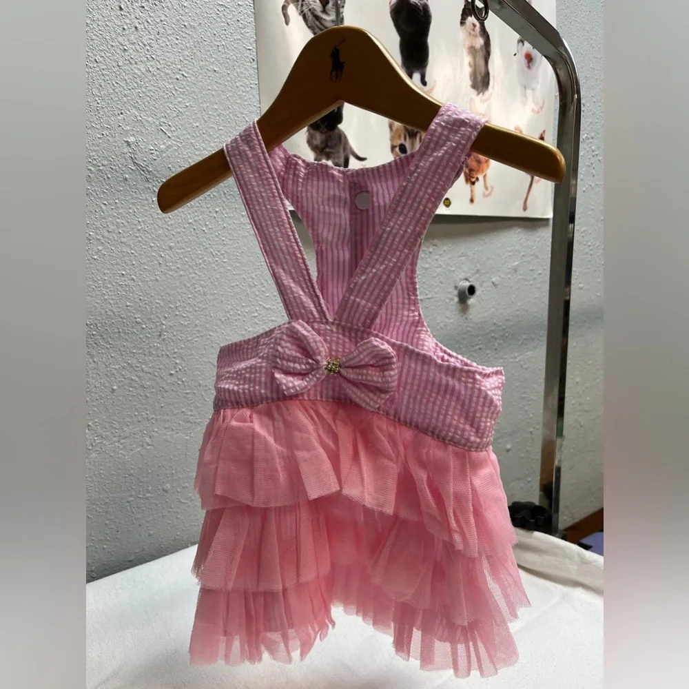 Pink and white striped ruffled dog dress with suspenders